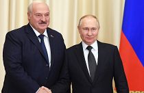 Russian President Vladimir Putin and Belarusian President Alexander Lukashenko shake hands during their meeting at the Novo-Ogaryovo state residence, outside Moscow.