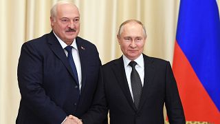 Russian President Vladimir Putin and Belarusian President Alexander Lukashenko shake hands during their meeting at the Novo-Ogaryovo state residence, outside Moscow.