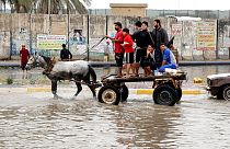 Iraqis make their way on a horse cart through a flooded street after heavy rain fell in Baghdad, Iraq, 20 November 2013.