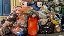 Street artist Bisk is turning trash into art during the pension protests in France