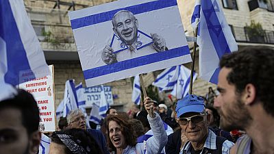 Israelis protest against Prime Minister Benjamin Netanyahu's judicial overhaul plan near his residencet in Jerusalem, Monday, March 27, 2023.