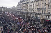 People march during a demonstration Tuesday, March 28, 2023 in Paris. Protests are taking place in France on Tuesday.