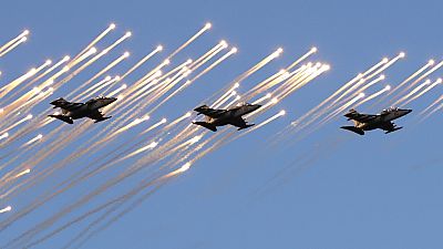 Belarusian army Su-25 jet fighters fly during a parade marking Independence Day in Minsk, Belarus, Wednesday, July 3, 2019.