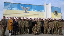 President Volodymyr Zelenskyy poses for a photo with military personnel, police officers and civilians during a visit to Okhtyrka in the Sumy region of Ukraine, Mar 28 2023