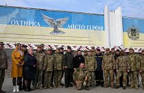 President Volodymyr Zelenskyy poses for a photo with military personnel, police officers and civilians during a visit to Okhtyrka in the Sumy region of Ukraine, Mar 28 2023