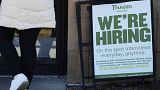 A hiring sign is displayed at a restaurant in Mount Prospect, Ill., March 19, 2023. 