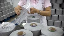 A worker at a textile manufacturing plant, as seen during a government organised trip for foreign journalists, in China's Xinjiang Uyghur Autonomous Region, April 2021.