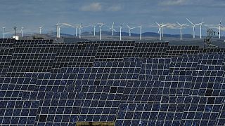 Solar panels work near the small town of Milagro, Navarra Province, northern Spain, on Feb. 24, 2023. 