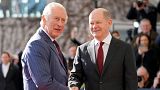 German Chancellor Olaf Scholz welcomes Britain's King Charles III at the chancellery in Berlin, Thursday, March 30, 2023.