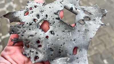 The metal fragment found at a bus stop hit by a missile demonstrates the destructive power of such missiles