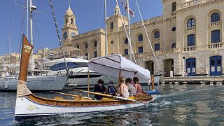 Tourists wear face masks as they enjoy a visit of the Valletta harbor in Malta on September 8, 2021.