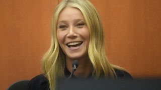 Gwyneth Paltrow laughs on the stand during her televised trial