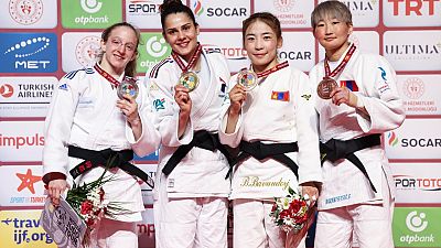 Judo athletes at the podium.