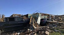 A home and vehicle is damaged from a storm in Little Rock, Ark., on Saturday, April 1, 2023.