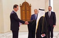 Bashar Assad shakes hands with Bahrain's new Ambassador to Syria, June 2022