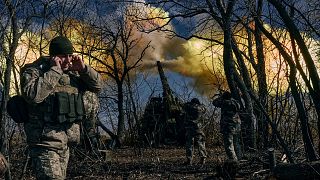 krainian soldiers fire a self-propelled howitzer towards Russian positions near Bakhmut, Donetsk region.
