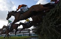 Riders on the final day of the Grand National Festival horse race meeting at Aintree Racecourse in Liverpool in 2022. 