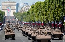 French servicemen drive Griffon multirole armoured vehicle during the Bastille Day military parade on the Champs-Élysées avenue in Paris on July 14, 2022.
