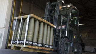  Airmen with the 436th Aerial Port Squadron use a forklift to move 155 mm shells ultimately bound for Ukraine in 2022.