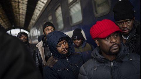 African residents in Ukraine wait at the platform inside Lviv railway station, Feb. 27, 2022, in Lviv, west Ukraine. 