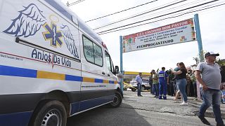An ambulance parked outside the private daycare center "Cantinho do Bom Pastor" after fatal attack on children in Blumenau, Santa Catarina state, Brazil, Wednesday, April 4 23
