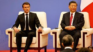 French President Emmanuel Macron, left, and Chinese President Xi Jinping take part in a Franco-Chinese business council meeting in Beijing, Thursday, April 6, 2023.