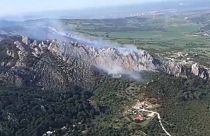 Wildfire burning in a mountainous area in Tarifa, a municipality in Spain.