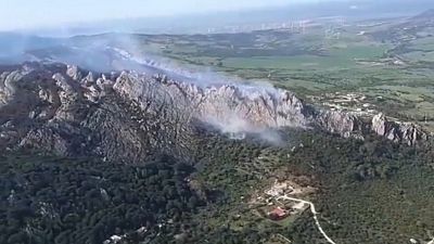 Wildfire burning in a mountainous area in Tarifa, a municipality in Spain.