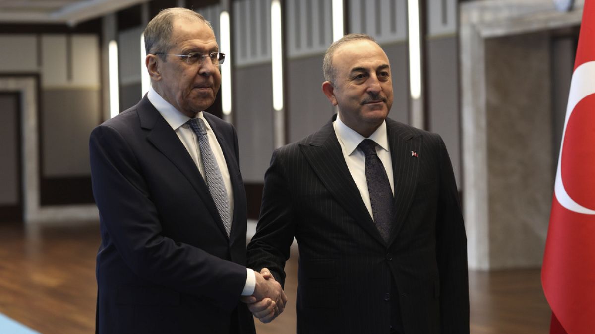 Turkish Foreign Minister Mevlut Cavusoglu, right, and his Russian counterpart Sergey Lavrov pose for photos before their talks, in Ankara, Turkey, Friday, April 7, 2023.