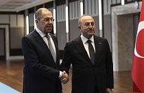 Turkish Foreign Minister Mevlut Cavusoglu, right, and his Russian counterpart Sergey Lavrov pose for photos before their talks, in Ankara, Turkey, Friday, April 7, 2023.