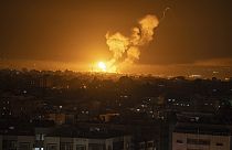 Fire and smoke rise following an Israeli airstrike in central Gaza Strip, Friday, April 7, 2023.