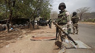 Gunmen kill at least 50 in attacks on village in Nigeria
