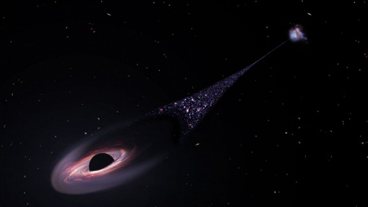 يتدفق الثقب الأسود في الفضاء تاركًا خلفه مئات النجوم