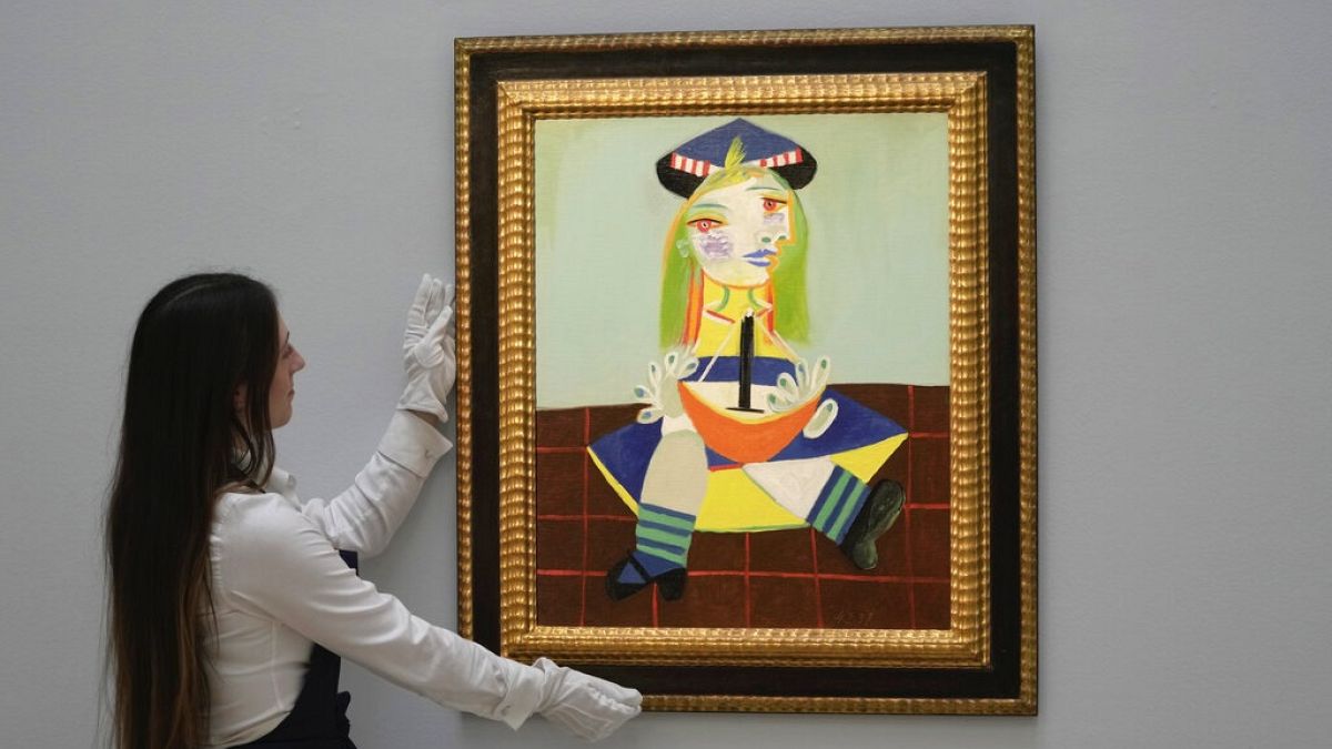 The painting " Maya" by Spanish painter Pablo Picasso in 1938, is on display during a media preview of Sotheby's auction, in London.