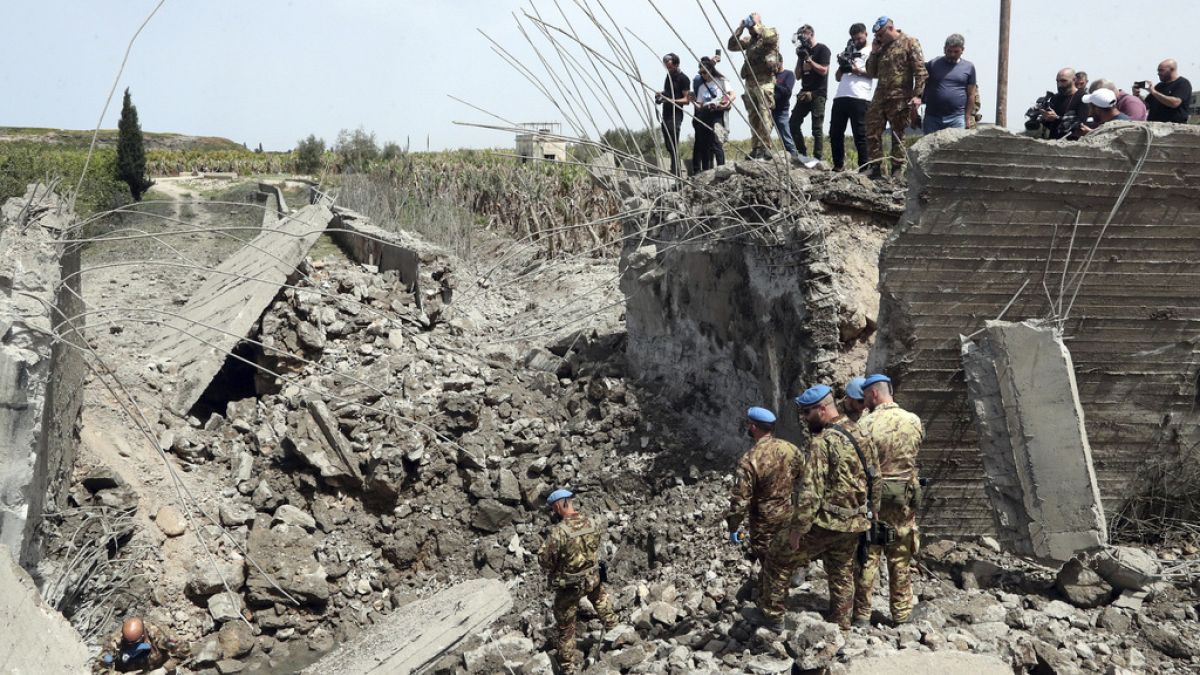  Italian U.N. peacekeeper soldiers inspect a small bridge that was destroyed by an Israeli airstrike, in Maaliya village, south Lebanon.