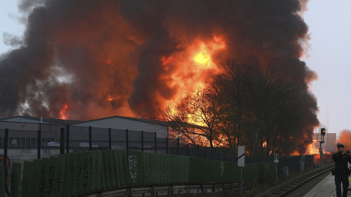 Huge flames rise from a fire in Hamburg, Germany, Sunday April 9, 2023. 
