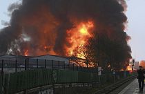 Huge flames rise from a fire in Hamburg, Germany, Sunday April 9, 2023.