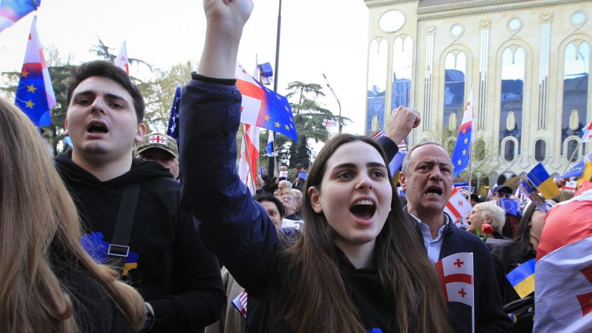 Demonstrators shout slogans during a rally organized by Georgian opposition parties in support of the country's membership in the European Union.