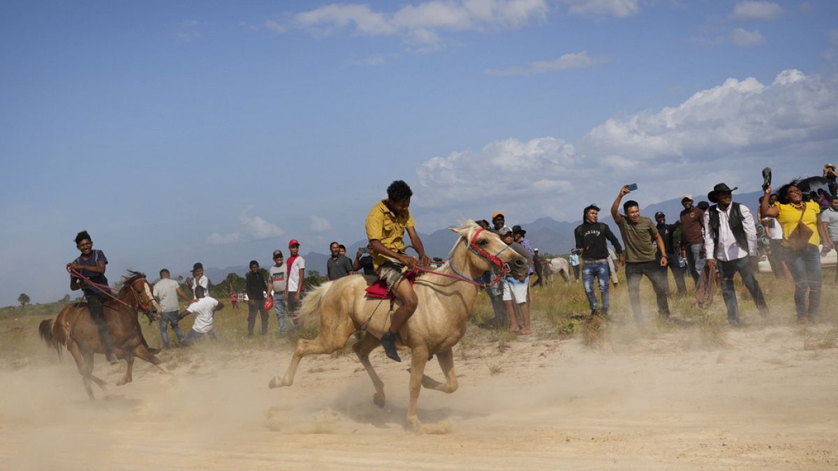 Youths race horses during the annual Rupununi Ranchers Rodeo festival, in Lethem, Guyana, Sunday, April 9, 2023. 