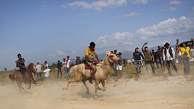Youths race horses during the annual Rupununi Ranchers Rodeo festival, in Lethem, Guyana, Sunday, April 9, 2023.