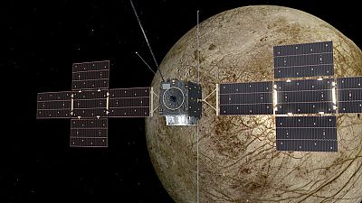 An artist's impression of Juice flying by Europa