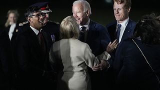 President Joe Biden is greeted by British PM Rishi Sunak as he steps off Air Force One at Belfast International Airport in Belfast, Northern Ireland,  April 11, 2023.