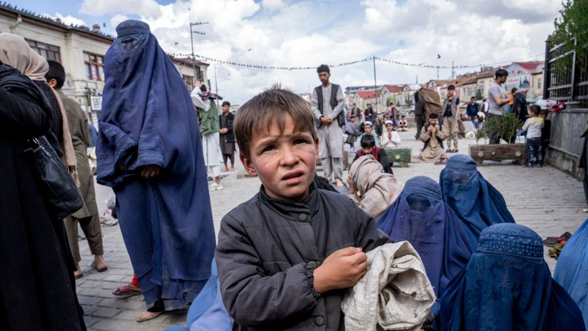 A boy and an Afghan women
