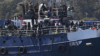 Boat carrying hundreds of migrants towed to safety by Italian Coast Guard
