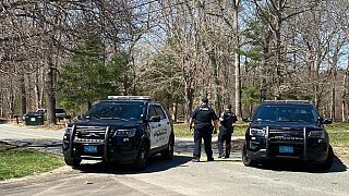 Police block a road in North Dighton, Massachusetts, Thursday, April 13, 2023. 