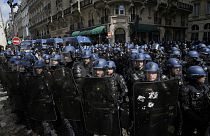 Riot police officers take position during a demonstration, Thursday, April 13, 2023 in Paris.