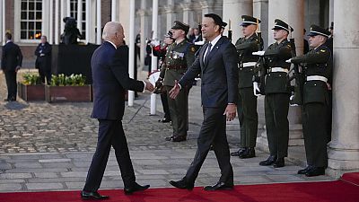 President Joe Biden shakes hands with Ireland's Taoiseach Leo Varadkar as he arrives for a banquet at Dublin Castle in Dublin, Ireland, Thursday, April 13, 2023