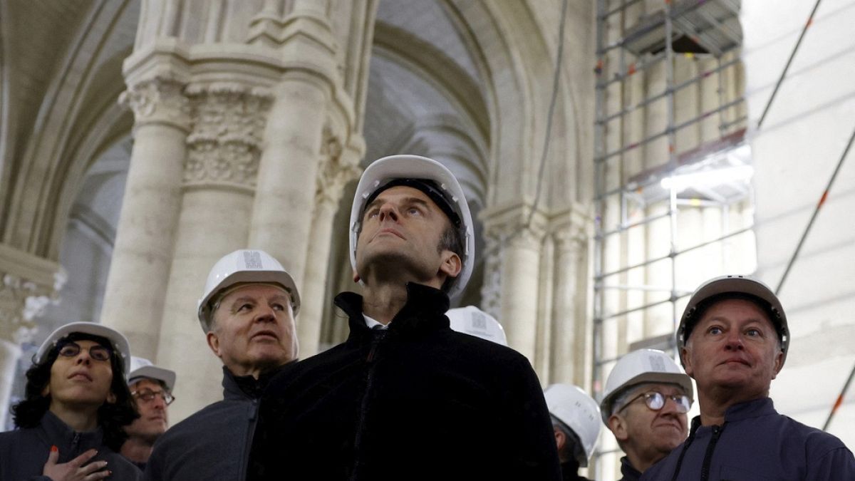 French President Emmanuel Macron, center, visits the restoration site at the Notre-Dame de Paris Cathedral,.-