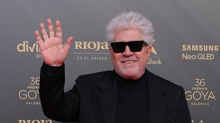Spanish film director Pedro Almodovar poses on the red carpet upon arrival at the 36th Goya awards ceremony at the Palau de les Arts in Valencia, on February 12, 2022.
