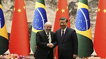 Brazilian President Luiz Inacio Lula da Silva, left, shakes hands with Chinese President Xi Jinping in Beijing, Friday, April 14, 2023
